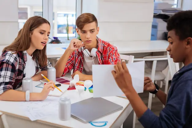 facilitator guiding secondary school students design thinking activity